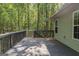 Deck with wooded view and stairs leading down at 5447 Centry Dr, Villa Rica, GA 30180