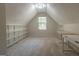 Versatile bonus room with built-in shelving and window, ideal for a home office at 5447 Centry Dr, Villa Rica, GA 30180
