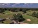 Aerial view showcasing a golf course with homes nestled among the fairways at 5447 Centry Dr, Villa Rica, GA 30180
