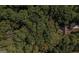 Aerial view of house nestled in lush woods at 5447 Centry Dr, Villa Rica, GA 30180