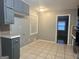 Bright kitchen features granite countertops and gray cabinets at 1196 Burbank Trl, Morrow, GA 30260