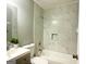 Updated bathroom with a bathtub and marble tile at 1196 Burbank Trl, Morrow, GA 30260