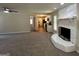 Open living room with views into the kitchen and a stone fireplace at 3869 Rosedale Ln, Douglasville, GA 30135