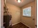 Laundry room with new flooring and shelving at 3869 Rosedale Ln, Douglasville, GA 30135