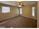 Spacious primary bedroom with neutral carpet and ample natural light at 3869 Rosedale Ln, Douglasville, GA 30135