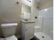 Updated bathroom with granite vanity and a shower at 3869 Rosedale Ln, Douglasville, GA 30135