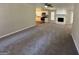 Spacious living room with gray carpeting, a stone fireplace, and an open floor plan at 3869 Rosedale Ln, Douglasville, GA 30135