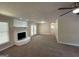 Spacious living room with a stone fireplace and neutral carpeting at 3869 Rosedale Ln, Douglasville, GA 30135