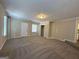 Spacious living room with neutral decor and carpet, plus closet space at 3869 Rosedale Ln, Douglasville, GA 30135