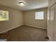Bright bedroom featuring neutral walls and carpet at 3869 Rosedale Ln, Douglasville, GA 30135