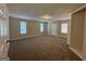 Bright living room with neutral carpeting and an exterior door at 3869 Rosedale Ln, Douglasville, GA 30135