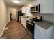 Modern kitchen featuring granite countertops and stainless steel appliances at 3869 Rosedale Ln, Douglasville, GA 30135