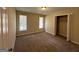 Well-lit bedroom with neutral carpeting and a large closet at 3869 Rosedale Ln, Douglasville, GA 30135