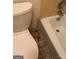 Bathroom with toilet, bathtub and tiled floor at 5914 Sutcliff Sq, Lithonia, GA 30058