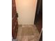 Tiled entryway with a wooden door leading into the condo at 5914 Sutcliff Sq, Lithonia, GA 30058