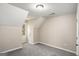 Cozy bedroom with gray carpet and a window at 23 Club Dr, Locust Grove, GA 30248