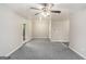 Spacious living room with gray carpet and ceiling fan at 23 Club Dr, Locust Grove, GA 30248