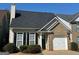 Brick and siding townhouse with a garage at 9585 Lakeview Cir, Union City, GA 30291