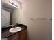 Small bathroom with vanity and dark countertop at 9585 Lakeview Cir, Union City, GA 30291
