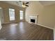 Bright living room features a fireplace and hardwood floors at 9585 Lakeview Cir, Union City, GA 30291