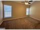 Main bedroom with carpet and ceiling fan at 9585 Lakeview Cir, Union City, GA 30291
