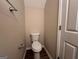 Simple bathroom with toilet and shower at 9585 Lakeview Cir, Union City, GA 30291