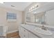 Bathroom with double vanity, marble countertop and large mirror at 8491 Cedar Creek Rdg, Riverdale, GA 30274