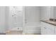 Bathroom with tub, shower, and granite vanity at 1925 School House Ln, Temple, GA 30179