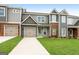 Modern townhome exterior with two-car garage at 1925 School House Ln, Temple, GA 30179