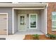 Inviting front entry with a light green door at 1920 Schoolhouse Ln # 9, Temple, GA 30179
