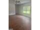 Spacious living room with hardwood floors and large windows at 1921 School House Ln, Temple, GA 30179