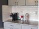 Kitchen with white subway tile and a Keurig coffee maker at 1242 Saxony Se Dr, Conyers, GA 30013