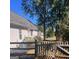 Backyard with fence, trees, and partial house view at 938 Mulberry Fields Cv, Auburn, GA 30011