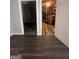 Basement with dark flooring and access to storage at 938 Mulberry Fields Cv, Auburn, GA 30011