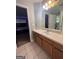 Bathroom with vanity, mirror, and tiled floor at 938 Mulberry Fields Cv, Auburn, GA 30011