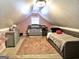 Charming attic bedroom with a crib and daybed at 938 Mulberry Fields Cv, Auburn, GA 30011