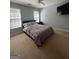Spacious bedroom with carpeting and large windows at 938 Mulberry Fields Cv, Auburn, GA 30011
