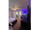 Bedroom with TV setup and access to bathroom at 938 Mulberry Fields Cv, Auburn, GA 30011