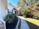 Landscaped front yard with walkway leading to house entrance at 938 Mulberry Fields Cv, Auburn, GA 30011
