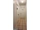 Hallway with doors to laundry and bathroom at 938 Mulberry Fields Cv, Auburn, GA 30011