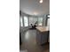 Eat-in kitchen with gray cabinets, ample counter space, and island at 938 Mulberry Fields Cv, Auburn, GA 30011
