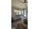 Open living room with kitchen views, fireplace, and access to backyard at 938 Mulberry Fields Cv, Auburn, GA 30011