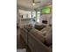 Spacious living room featuring a sectional sofa and fireplace at 938 Mulberry Fields Cv, Auburn, GA 30011