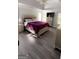 Large main bedroom with plush bed and neutral decor at 938 Mulberry Fields Cv, Auburn, GA 30011