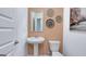Small bathroom with pedestal sink and peach colored walls at 544 Whitman (Lot 12) Ln # 2012, Stockbridge, GA 30281