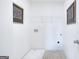 Clean laundry room featuring shelving and a utility tub at 544 Whitman (Lot 12) Ln # 2012, Stockbridge, GA 30281