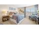 Bedroom with a queen bed, patterned bedding, and stylish decor at 544 Whitman (Lot 12) Ln # 2012, Stockbridge, GA 30281