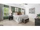 Spacious bedroom with large windows and green accent wall at 544 Whitman (Lot 12) Ln # 2012, Stockbridge, GA 30281
