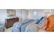 Bedroom with a queen bed, dresser, and colorful bedding at 544 Whitman (Lot 12) Ln # 2012, Stockbridge, GA 30281