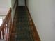 Wooden staircase with patterned carpet runner at 402 Thurman Rd, Stockbridge, GA 30281